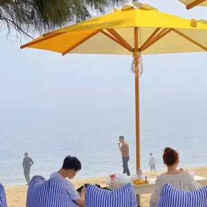Custom Bright Yellow Beach Umbrella with Wooden Pole for Seaside Cafe and Resort Use