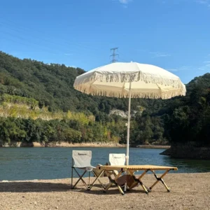 Custom Luxury Wooden Grain Iron Pole Beach Parasol Umbrella With Cotton Tassels